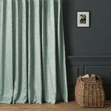 Curtains in a contemporary damask fabric with light blue colours.