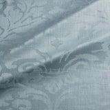 Fabric swatch of a contemporary damask fabric in a blue colour for upholstery and curtains.
