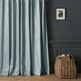 Curtains in a contemporary damask fabric with blue colours.