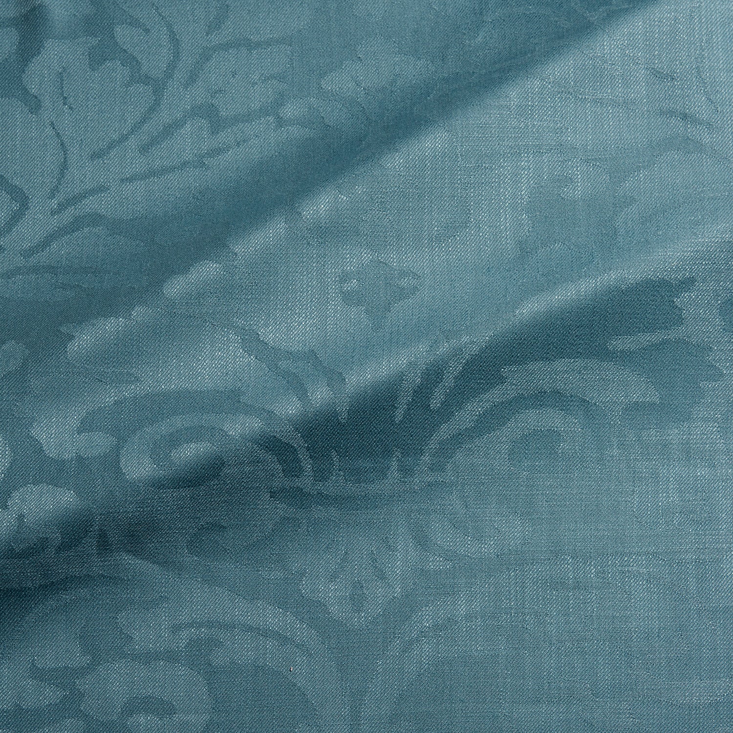 Fabric swatch of a contemporary damask fabric in a blue colour for upholstery and curtains.