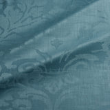Fabric swatch of a contemporary damask fabric in a blue colour for upholstery and curtains.