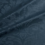 Fabric swatch of a contemporary damask fabric in a dark blue colour for upholstery and curtains.