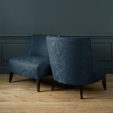 Armchairs in a contemporary damask fabric with dark blue colours.