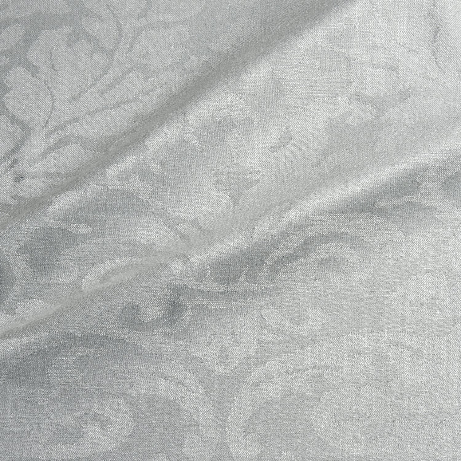 Fabric swatch of a contemporary damask fabric in a light cream colour for upholstery and curtains.
