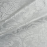 Fabric swatch of a contemporary damask fabric in a light cream colour for upholstery and curtains.