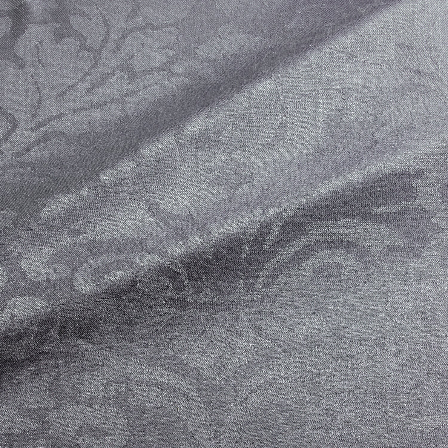 Fabric swatch of a contemporary damask fabric in a grey colour for upholstery and curtains.