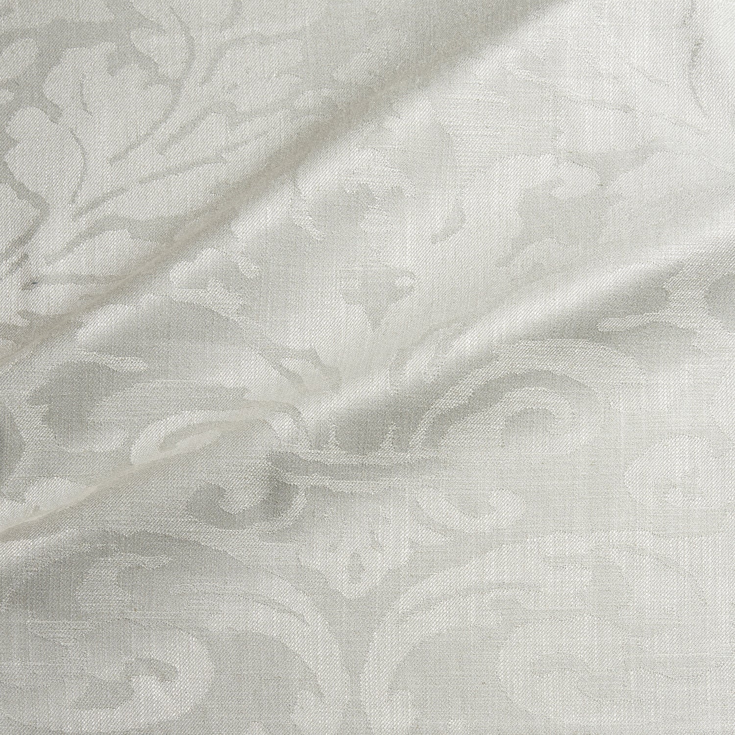 Fabric swatch of a contemporary damask fabric in a cream colour for upholstery and curtains.