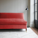 Pink velvet upholstery fabric on a classic sofa.