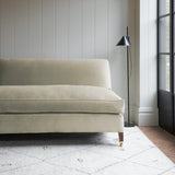 Cream velvet upholstery fabric on a classic sofa.