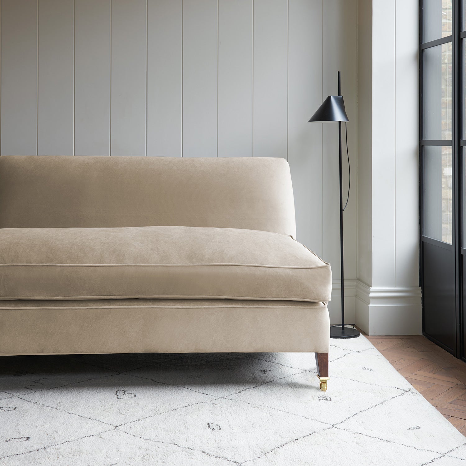 Cream velvet upholstery fabric on a classic sofa.