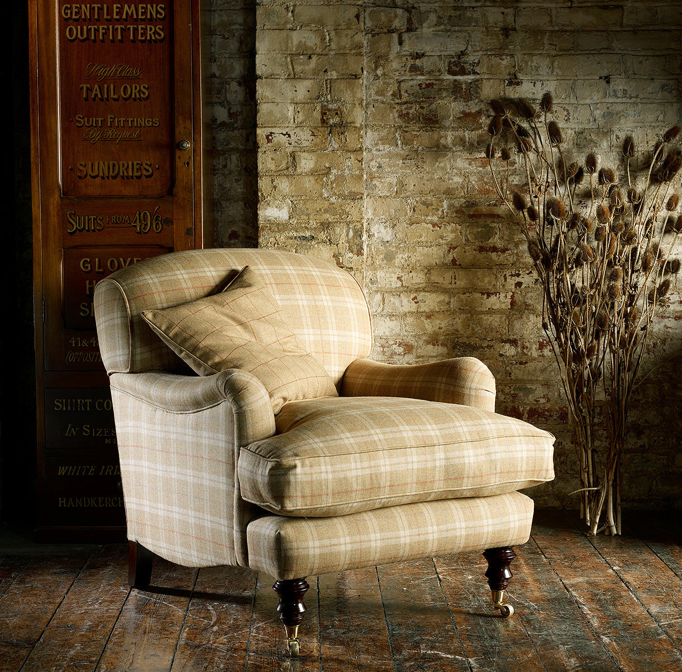 Chair upholstered in a beige Scottish wool plaid check fabric