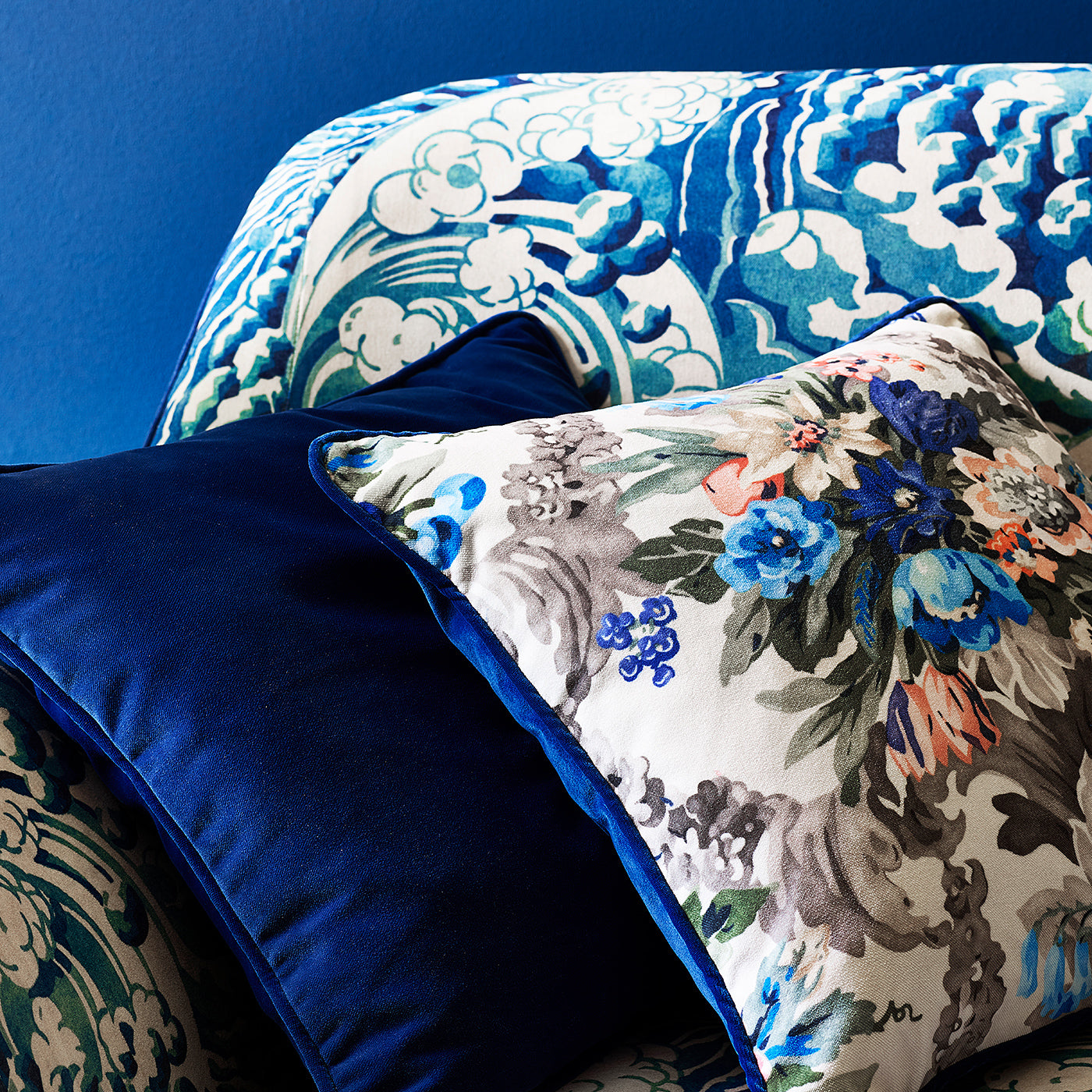 Printed velvet cushions in a classical floral pattern.