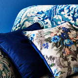 Printed velvet cushions in a classical floral pattern.