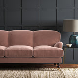 Pink eco velvet upholstery fabric on a sofa