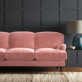 Pink eco velvet upholstery fabric on a sofa