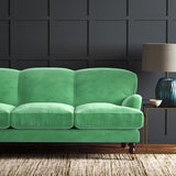 Green eco velvet upholstery fabric on a sofa