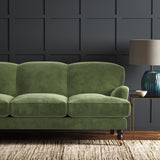 Green eco velvet upholstery fabric on a sofa