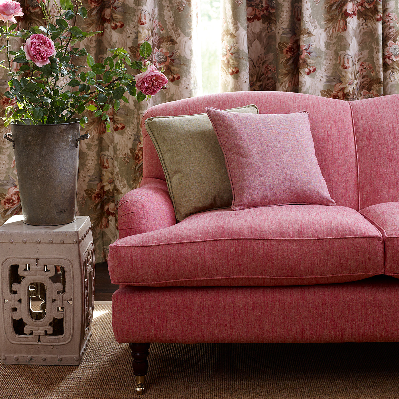 A pink stain resistant woven fabric on an armchair.
