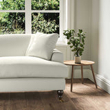 A white, stain resistant woven fabric on an armchair.