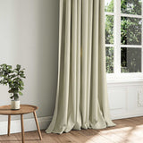 A cream woven fabric shown as a curtain.