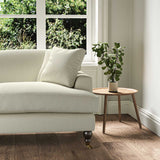 A cream stain resistant woven fabric on an armchair.