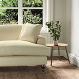 A beige, stain resistant woven fabric on an armchair.