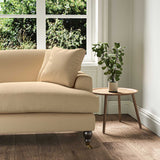 A beige stain resistant woven fabric on an armchair.