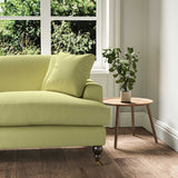 A green stain resistant woven fabric on an armchair.
