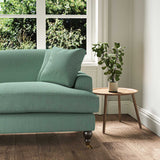 A blue stain resistant woven fabric on an armchair.