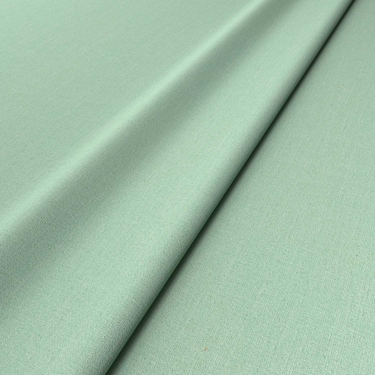Sample of a green woven fabric.