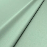 Sample of a green woven fabric.