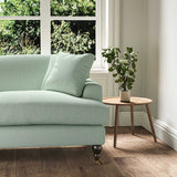 A blue, stain resistant woven fabric on an armchair.
