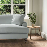 A blue stain resistant woven fabric on an armchair.