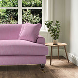 A purple, stain resistant woven fabric on an armchair.