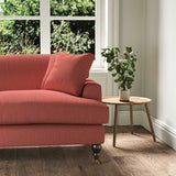 A red stain resistant woven fabric on an armchair.