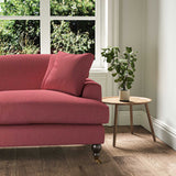 A red stain resistant woven fabric on an armchair.