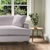 A purple stain resistant woven fabric on an armchair.