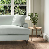 A blue stain resistant woven fabric on an armchair.