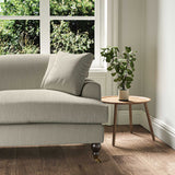 A grey stain resistant woven fabric on an armchair.