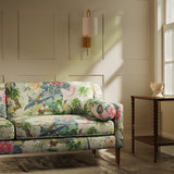 Sofa upholstered in a linen fabric with a floral and bird design