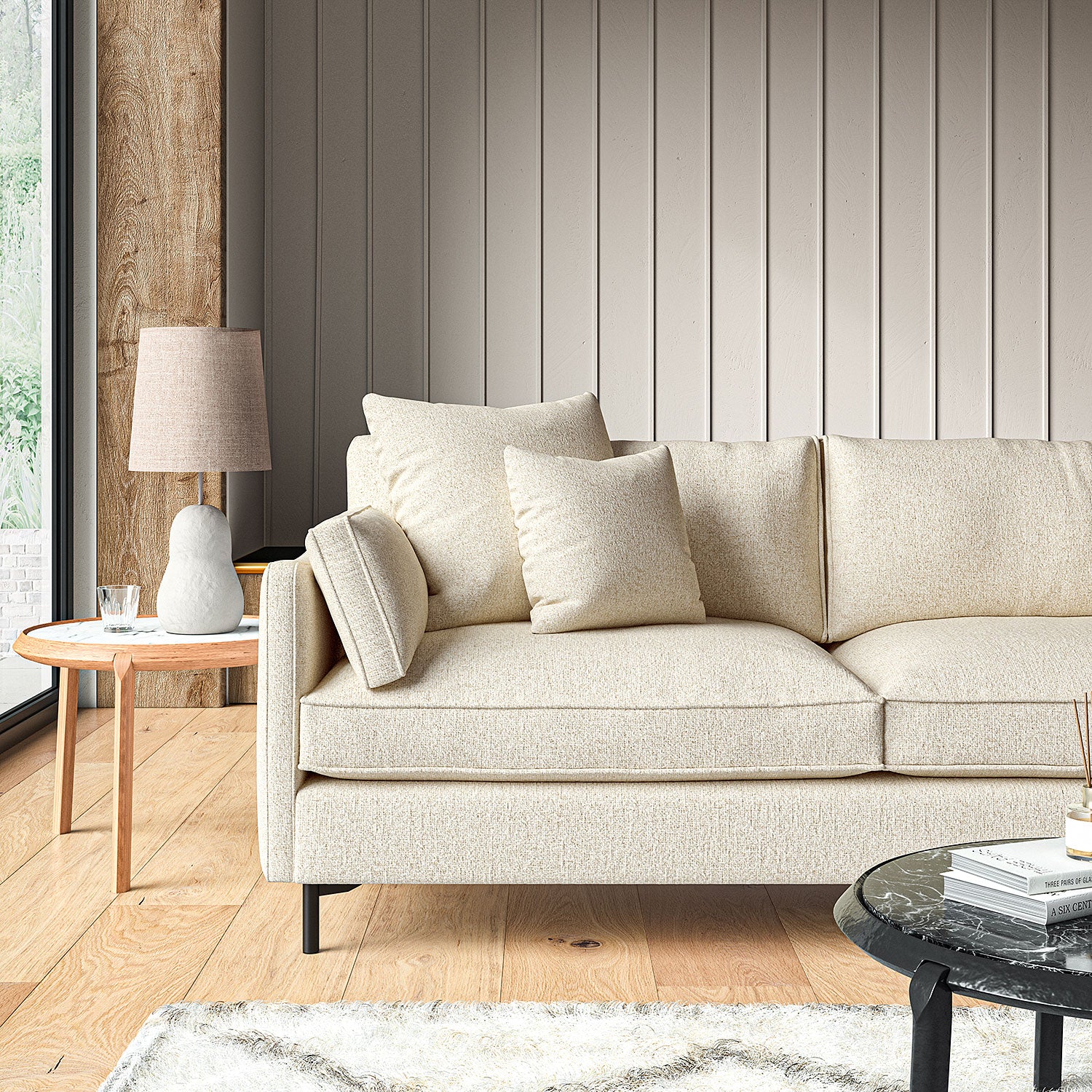 Sofa covered in a boucle fabric in Buttermilk
