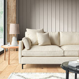 Sofa covered in a boucle fabric in Buttermilk