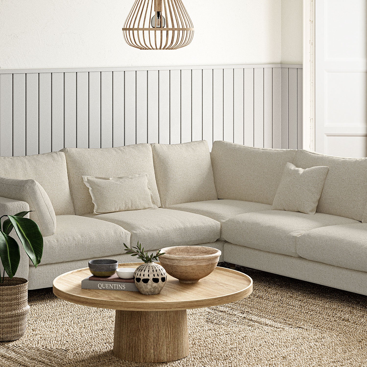 Sofa covered in a boucle fabric in Buttermilk