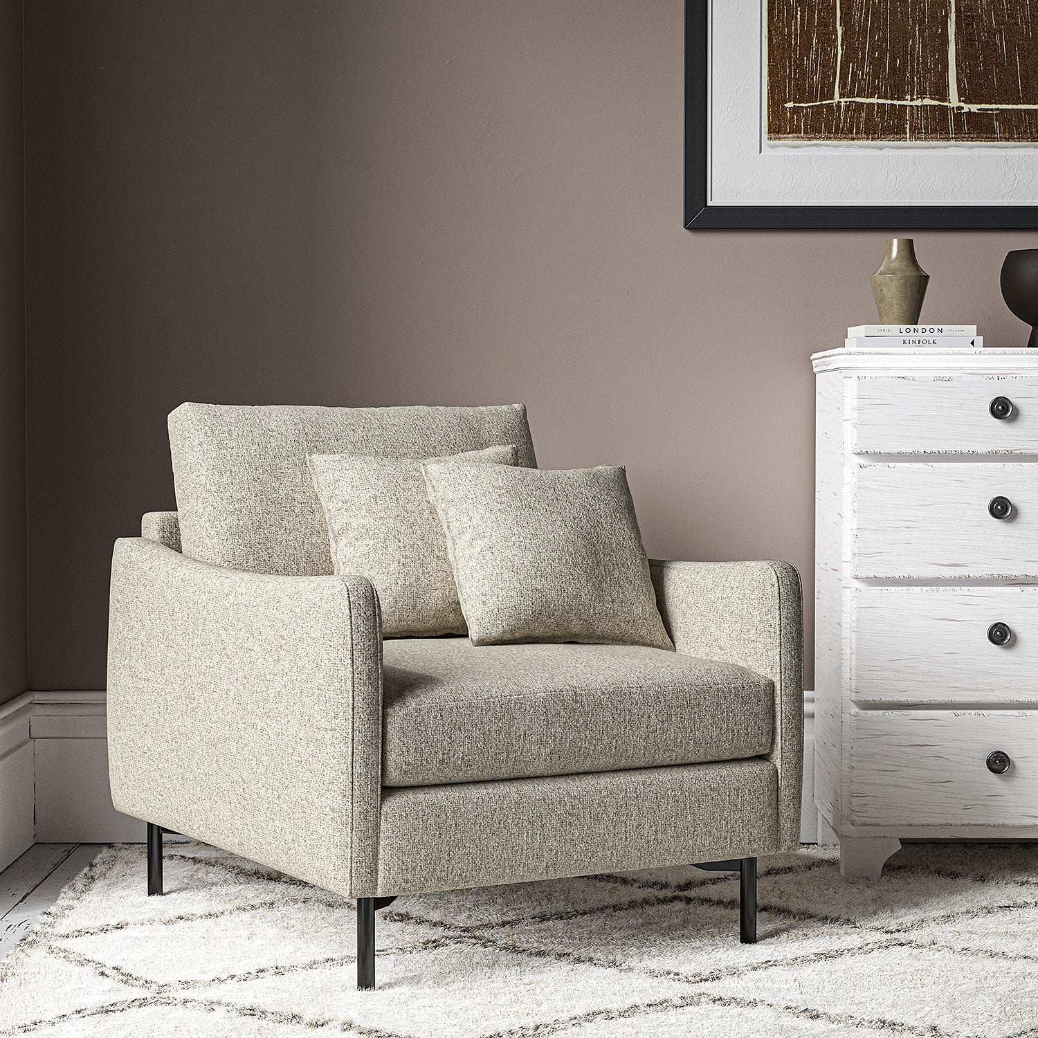 Chair covered in a boucle fabric in Dove Grey