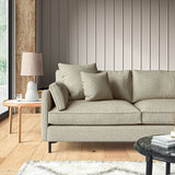Sofa covered in a boucle fabric in Hemp