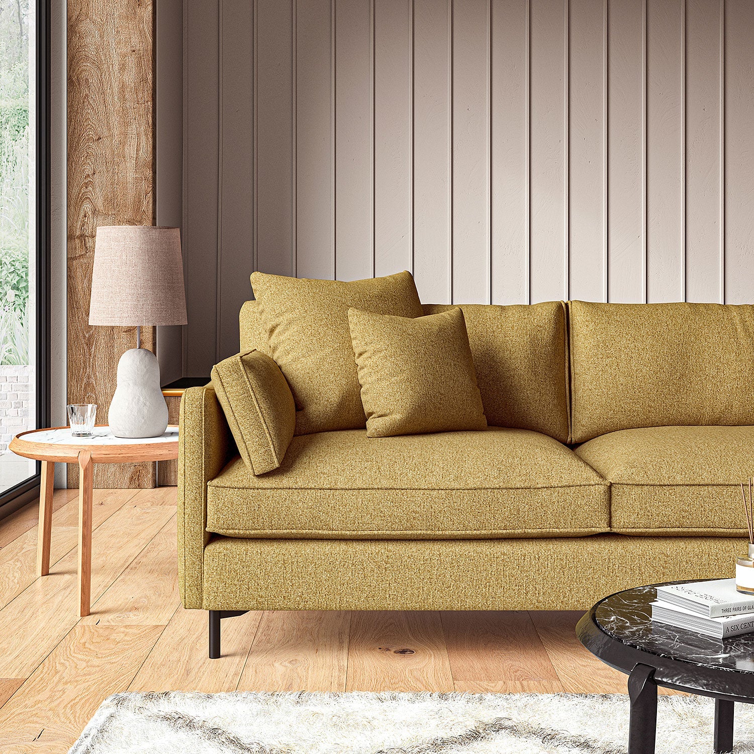 Sofa covered in a boucle fabric in Amber 