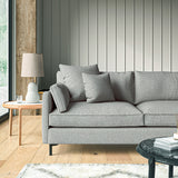 Sofa covered in a boucle fabric in Blue Stone