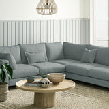 Sofa covered in a boucle fabric in Blue Stone