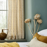 Linen curtains with a hand drawn; mirrored leaf motif pattern in yellow and cream