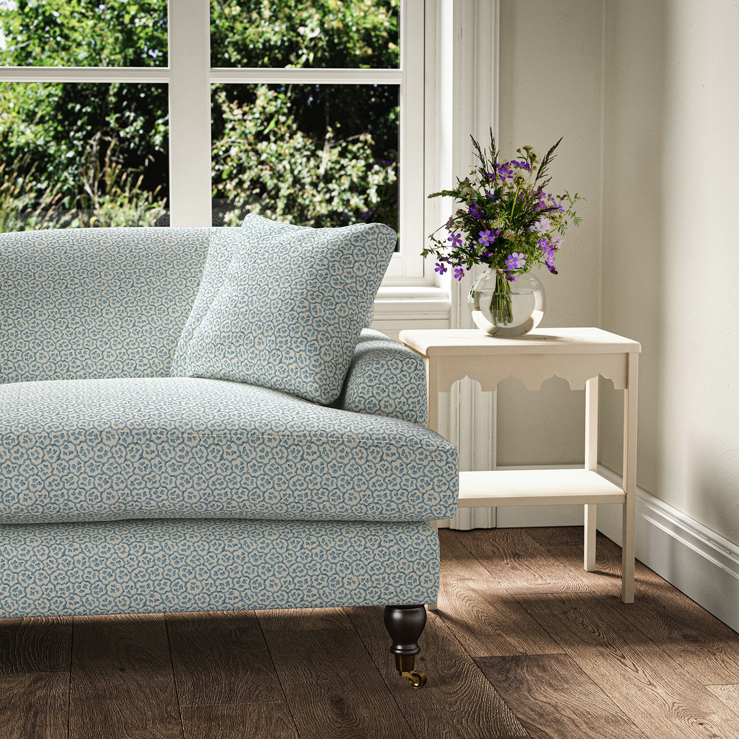 Printed linen fabric – a handy block print pattern in blue and cream – on a sofa